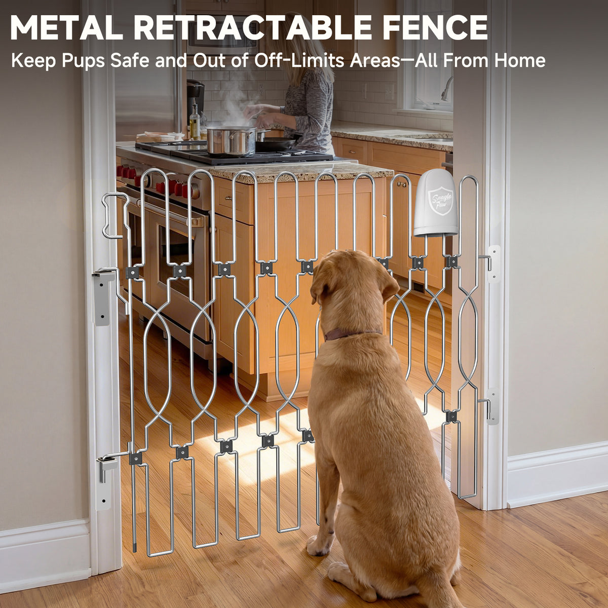 Snagle Paw retractable metal dog gate across a kitchen doorway, with a dog sitting outside while a person cooks inside.