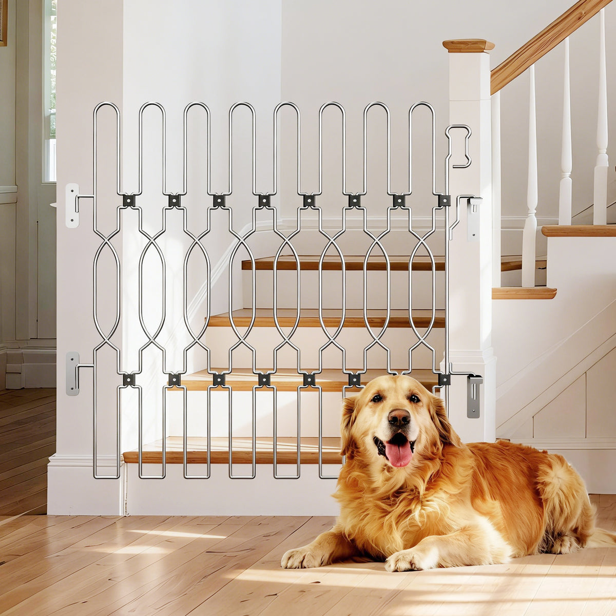 Snagle Paw retractable metal dog gate at the bottom of a staircase, with a golden retriever lying on the wooden floor in front.