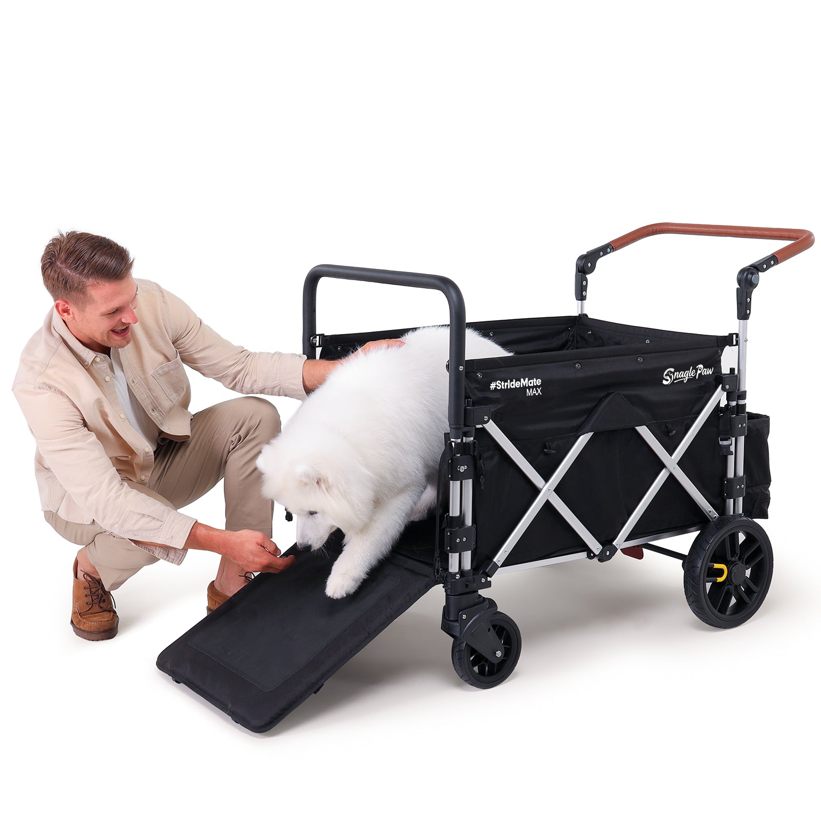 Senior dog carefully walking down the ramp of Snagle Paw StrideMate MAX stroller wagon, safe and spacious design, perfect for injured or elderly dogs with heavy-duty all-terrain frame

