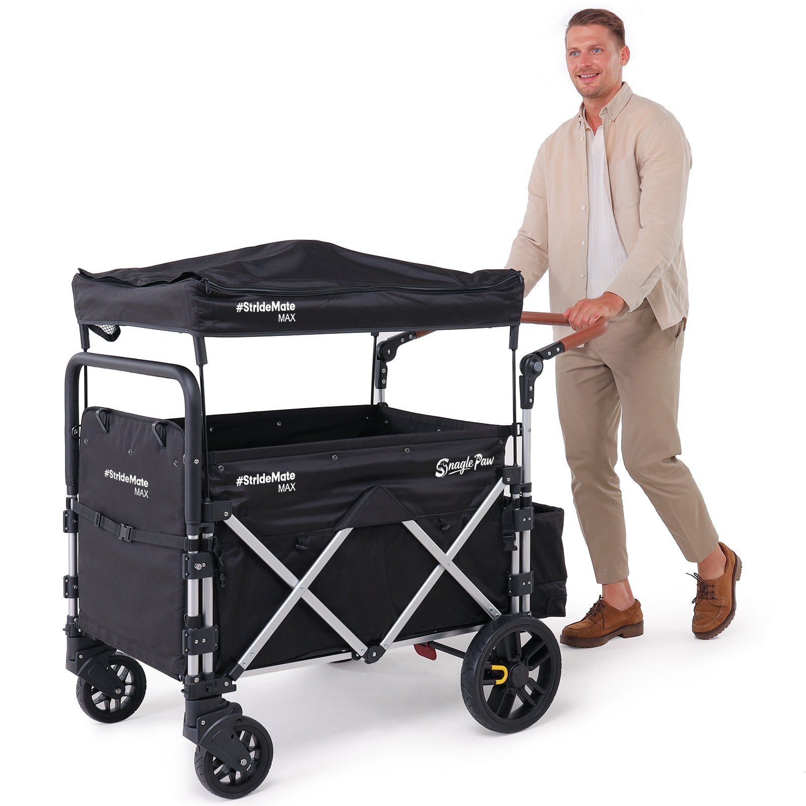 Tall person pushing Snagle Paw StrideMate MAX stroller wagon, demonstrating the large and spacious design suitable for senior and injured dogs, heavy-duty all-terrain frame