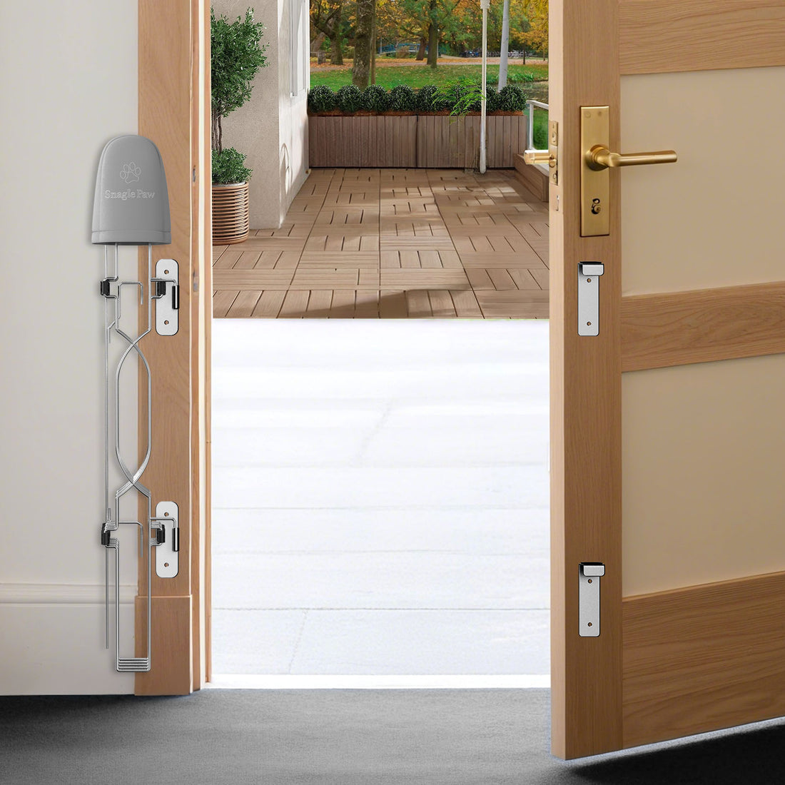 SnaglePaw retractable door barrier for the front door, creating a strong yet transparent pet safety boundary that prevents dogs from rushing outside while keeping the entryway open and tidy.